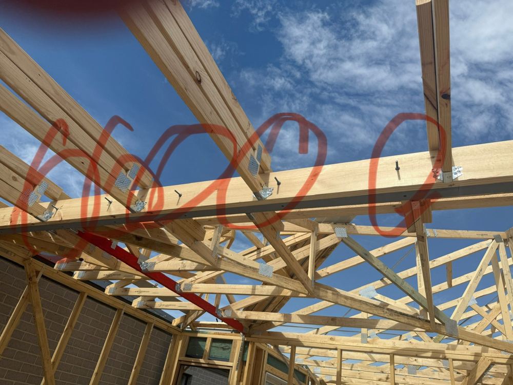 Marked floor-framing and support details recorded during the frame inspection.