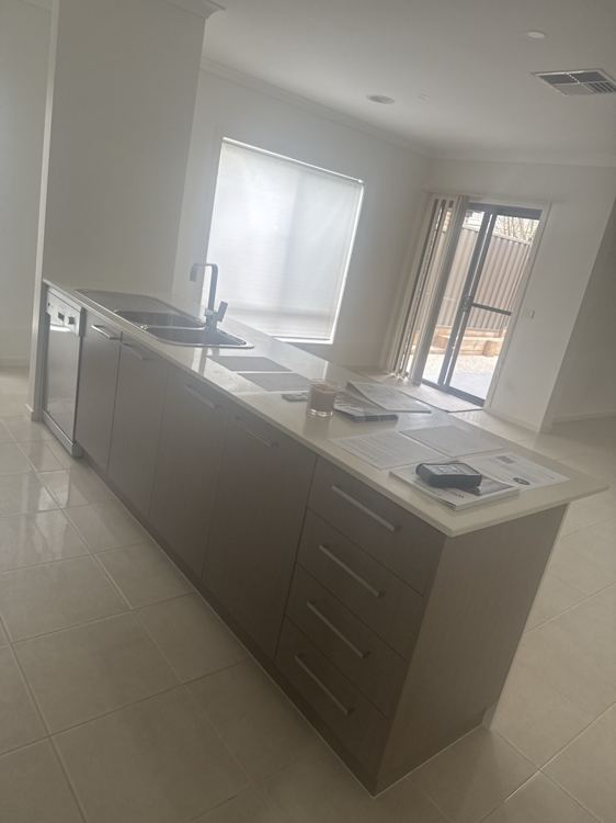 Kitchen cabinetry, benchtops and visible finishes recorded at handover.