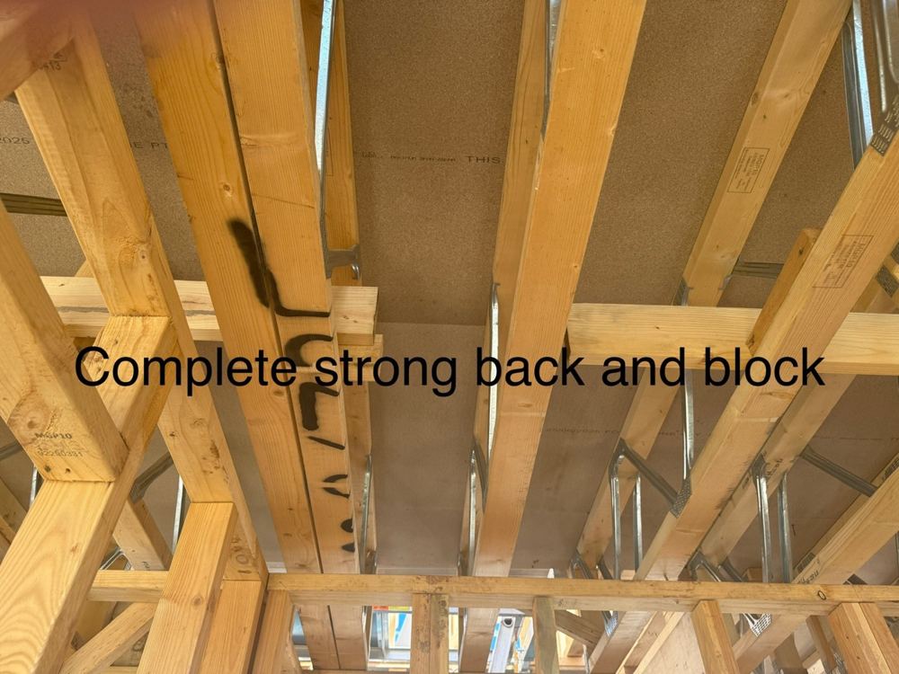 Marked strongback and blocking detail requiring attention during frame inspection.