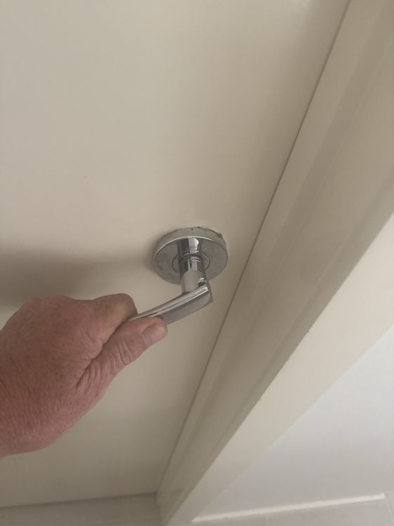 Door-handle operation checked during the inspection.