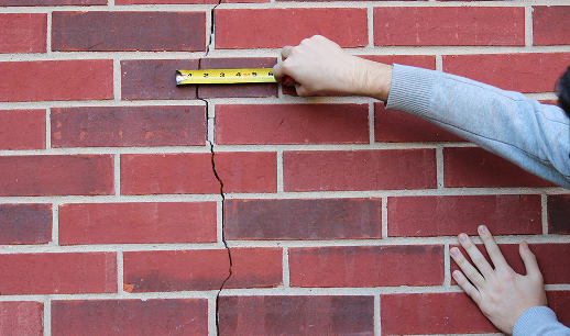 Recording an existing brickwork crack with a tape measure